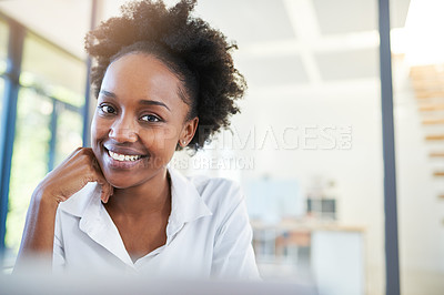 Buy stock photo Portrait of a confident young businesswoman sitting in a modern office