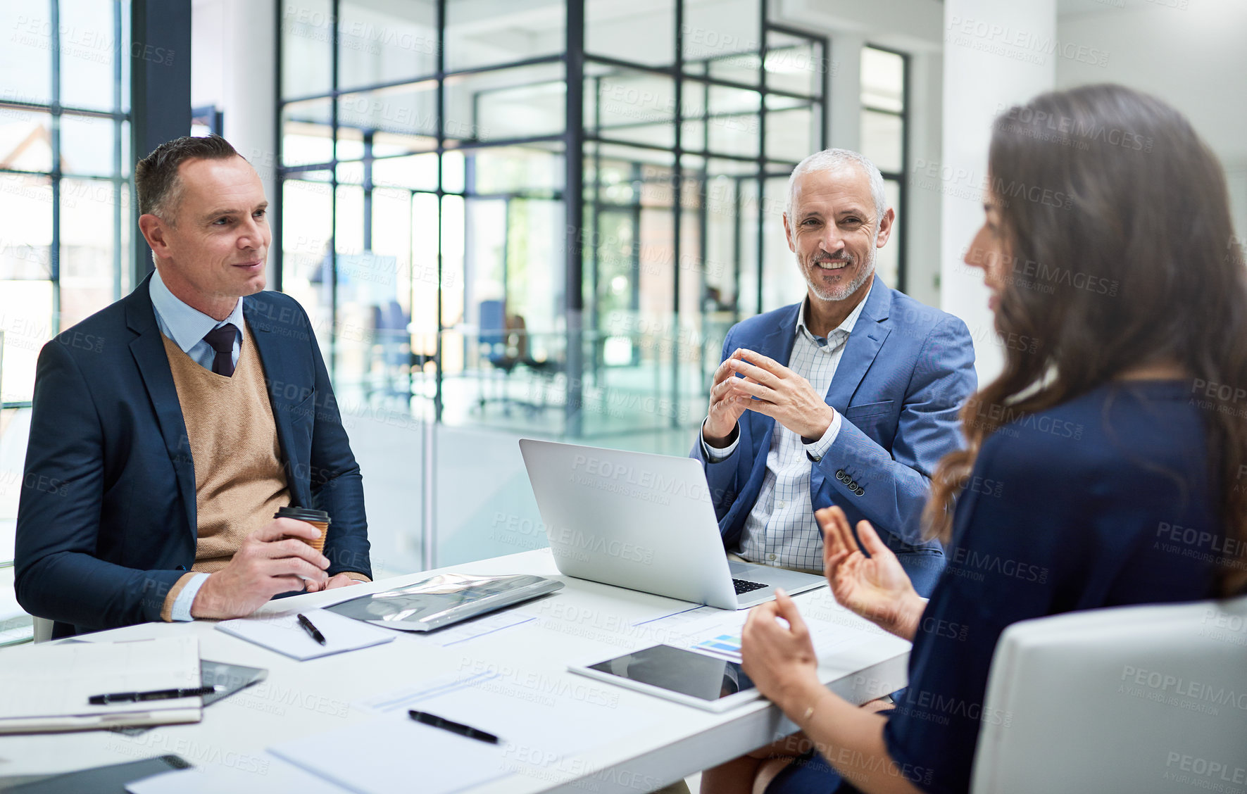 Buy stock photo Cropped shot of businesspeople having a meeting in a modern office