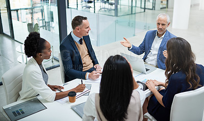 Buy stock photo Cropped shot of businesspeople having a meeting in a modern office