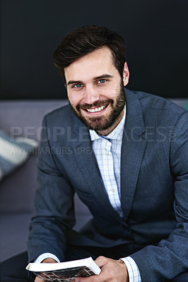 Buy stock photo Happy, book and portrait of businessman reading on sofa in waiting area for corporate knowledge at office. Smile, career and male financial advisor enjoying finance literature on couch in workplace.