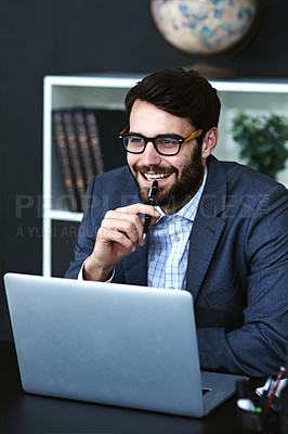 Buy stock photo Cropped shot of a young businessman sitting in front of a laptop and thinking in a modern office