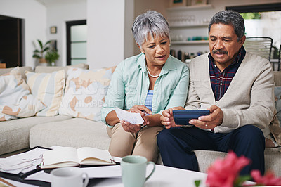 Buy stock photo Elderly couple, financial debt and life insurance discussion with banking document and bills. Retirement fund, senior people and communication in a home living room with paperwork and contract