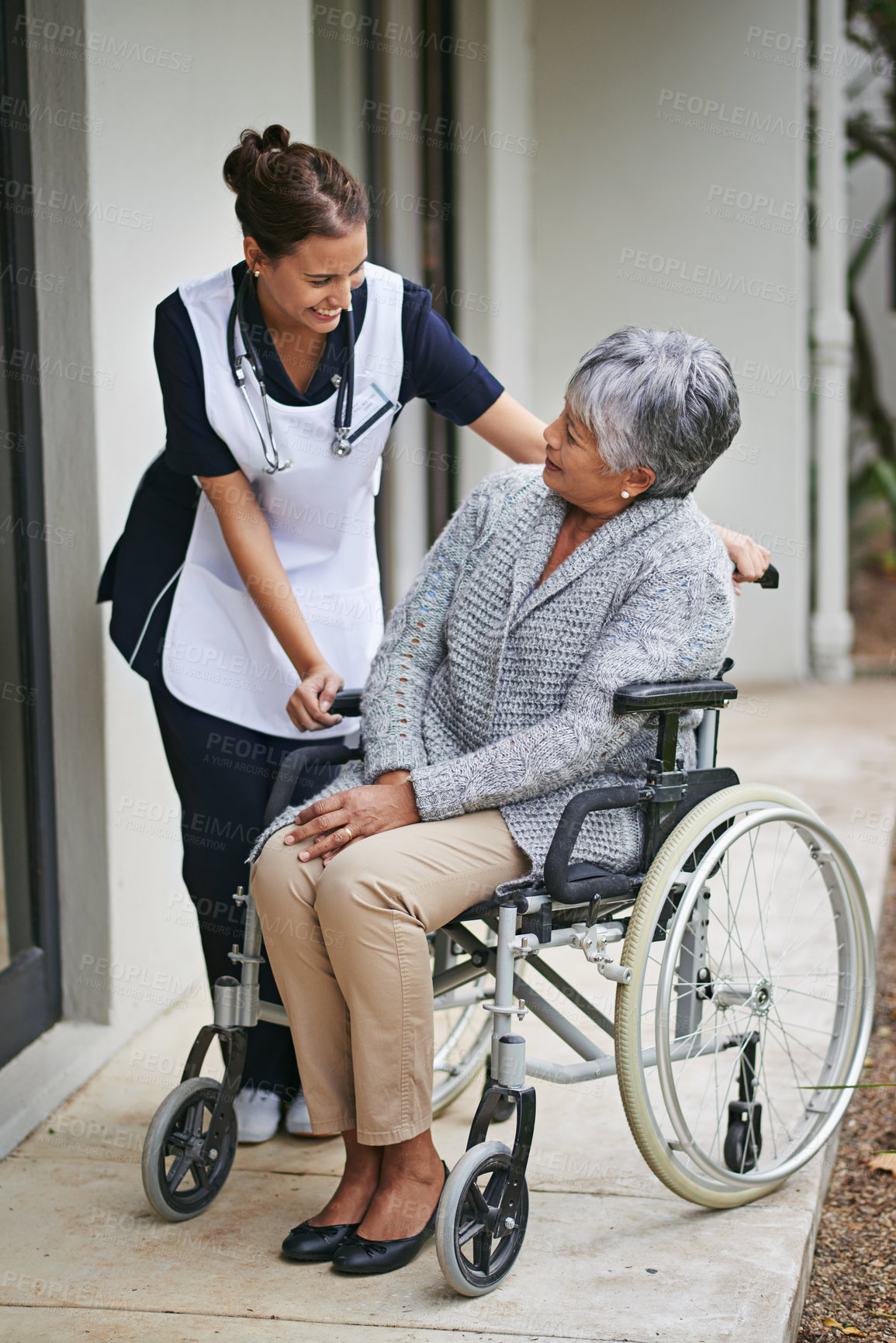 Buy stock photo Disabled patient and wheelchair at nursing home with nurse for assistance with disability, help at clinic. Senior woman or medical or outdoors for talk or plan for healthcare, conversation with carer
