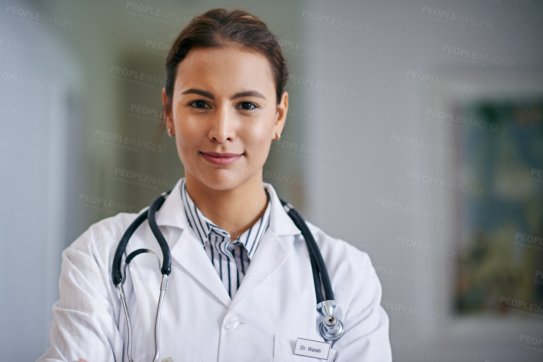 Buy stock photo Portrait of a confident young doctor at work