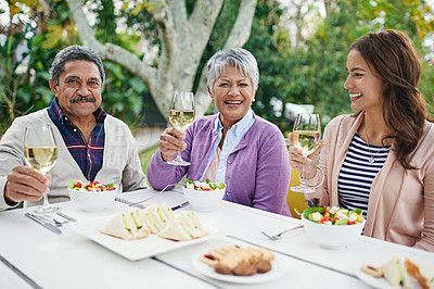 Buy stock photo Happy family and sitting with food or lunch together outside for celebration on summer vacation or holiday. Parents and woman, wine, toast and cheers with smile for weekend meal or tradition on break