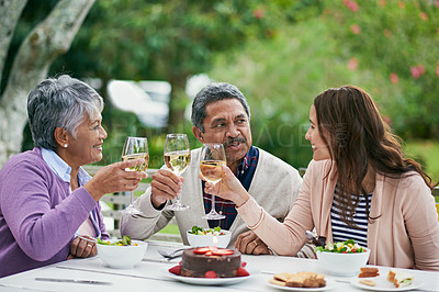 Buy stock photo Senior, parents and woman in garden, champagne and outdoor for celebration of anniversary for elderly couple. Summer, relax and healthy food and salad with cake for lunch or brunch with family