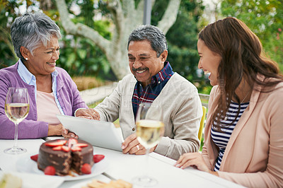 Buy stock photo Senior, couple and laughing, outdoor and tablet for celebration of anniversary of parents with champagne. Summer, relax and weekend, cake and lunch for brunch in backyard or garden, woman and family