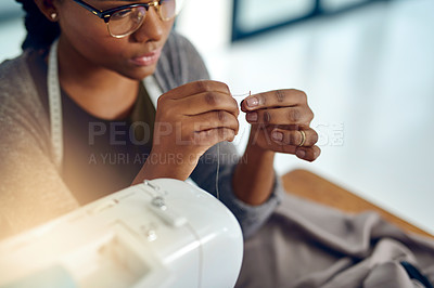 Buy stock photo Shot of a young designer doing some needle work