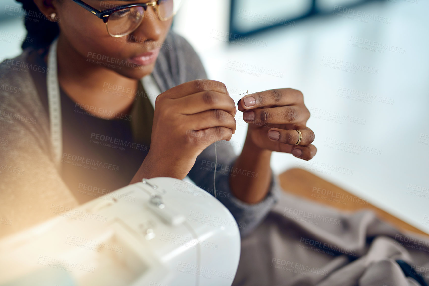 Buy stock photo Sewing, tailor and black woman with needle, designer and manufacturing work for boutique startup. Fashion, machine and creativity of seamstress with clothing construction and textile at workshop