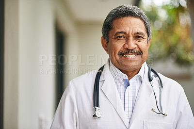 Buy stock photo Portrait of a mature male doctor standing outside