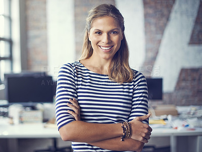 Buy stock photo Cropped shot of an attractive young designer standing in her office