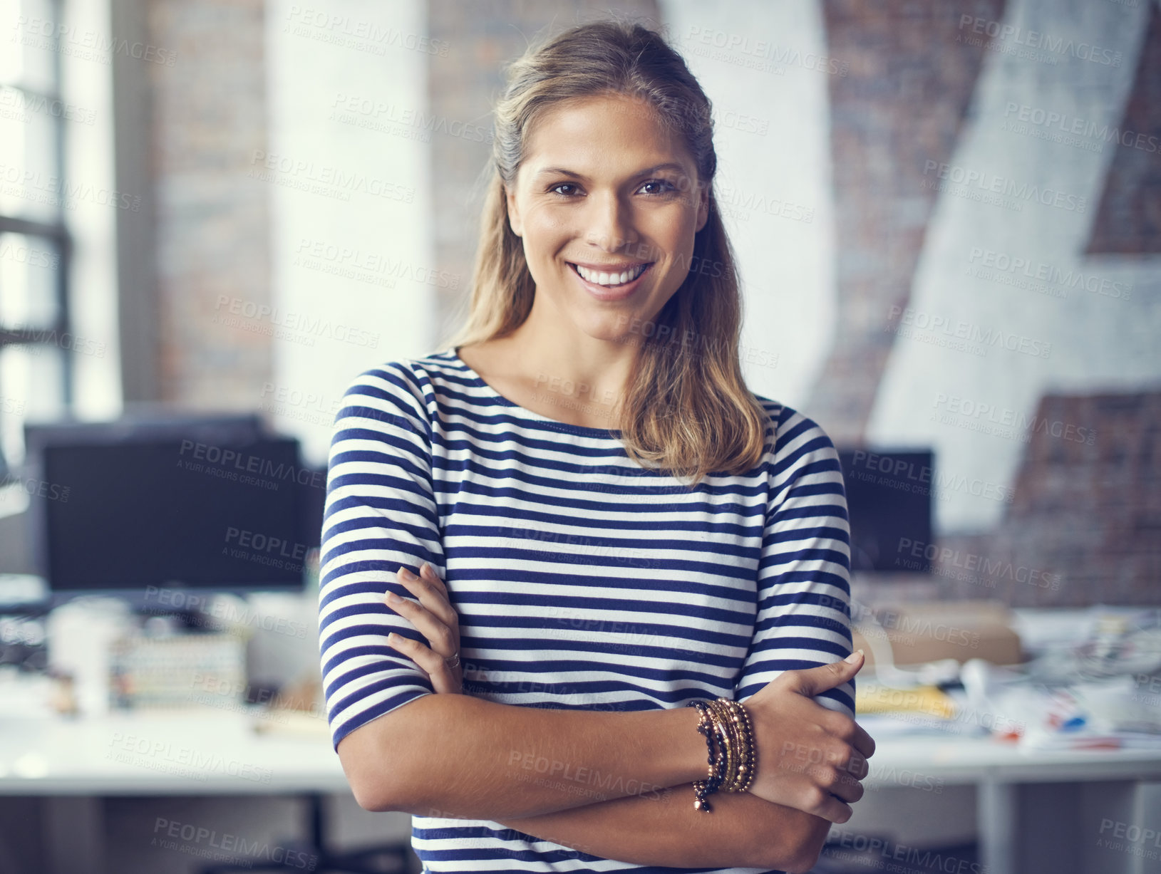 Buy stock photo Cropped shot of an attractive young designer standing in her office
