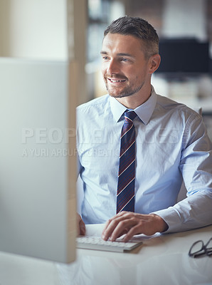 Buy stock photo Cropped shot of a businessman working on his computer in an office