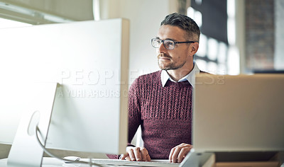 Buy stock photo Cropped shot of a businessman working on his computer in an office