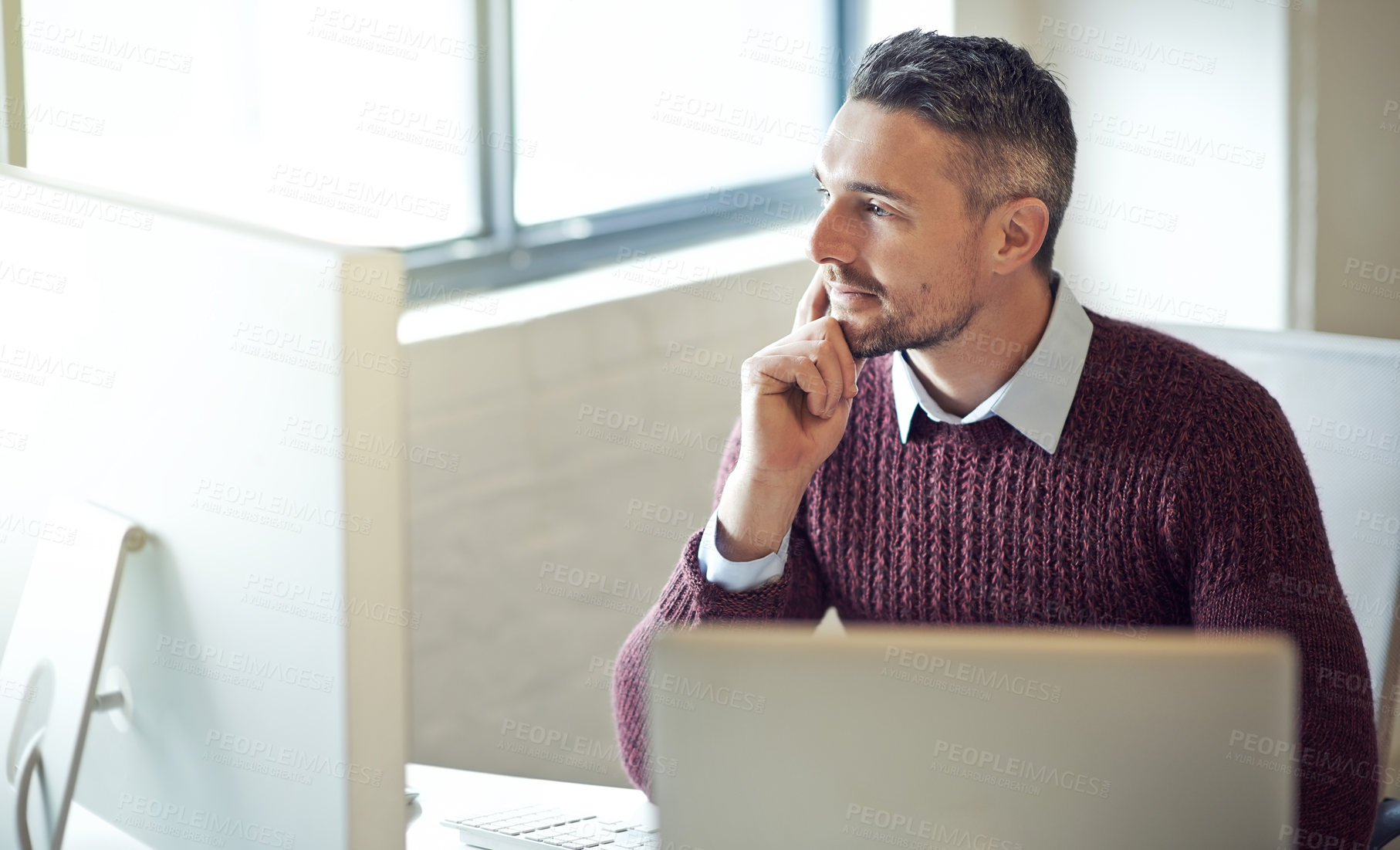 Buy stock photo Cropped shot of a businessman working on his computer in an office