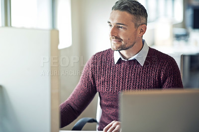 Buy stock photo Cropped shot of a businessman working on his computer in an office