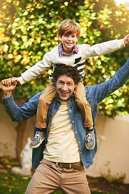 Buy stock photo Dad, son and portrait on shoulders in outdoors, flying game and playing in backyard for bonding. Father, boy and love in garden for fantasy adventure or pretend, care and carrying child for support