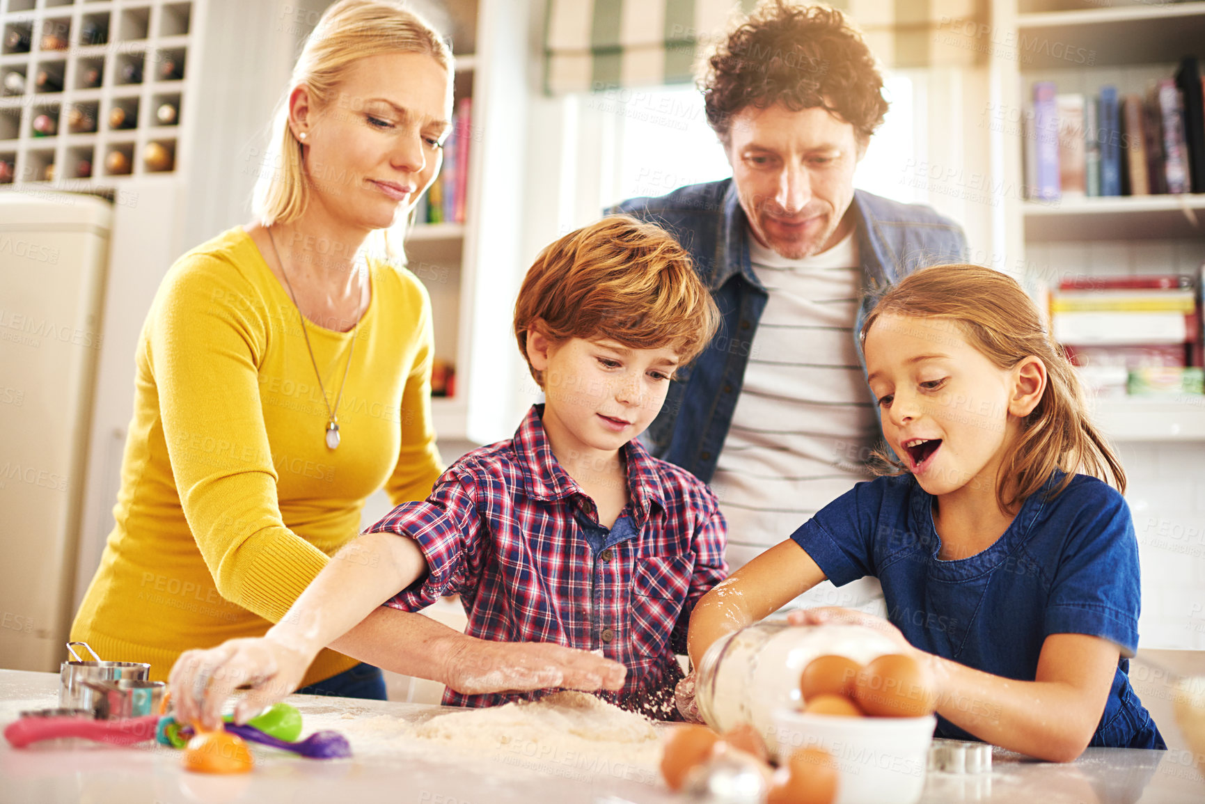 Buy stock photo Happy, family and baking in kitchen with love to support bonds, teamwork and teaches math skills at home. Mom, dad and children with creativity, learning and bond by bake cooking cookies together