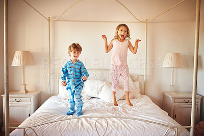 Buy stock photo Children, happy and jumping on bed for fun together, play time or adventure in morning. Energetic, boy and girl excited during school holidays, break or vacation in parents bedroom for entertainment