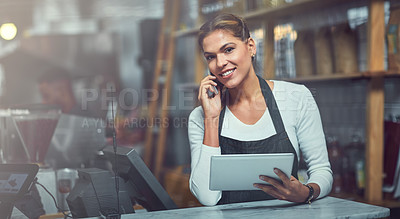 Buy stock photo Portrait of a young woman using a phone and digital tablet in the store that she works at