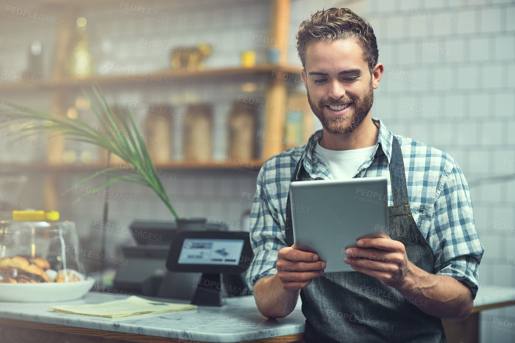 Buy stock photo Tablet, man and portrait of barista in coffee shop for online menu update or stock control. Serving industry, cafe and male waiter with digital technology for inventory report in restaurant.