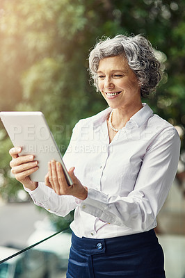 Buy stock photo Mature, woman and tablet in workplace for business with online search, communication and video call for client. Happy ceo, technology and smile with internet meme for work break, connection and joke