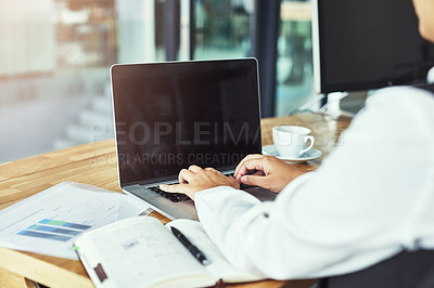 Buy stock photo Closeup shot of a businesswoman working on a laptop in a modern office