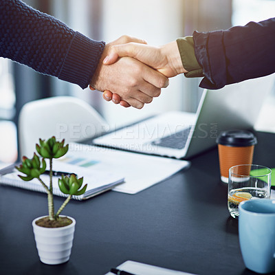 Buy stock photo Cropped shot of two unrecognizable businesspeople shaking hands in the office
