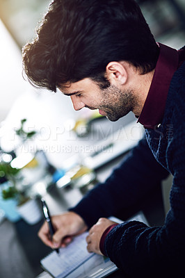Buy stock photo Man, home office and smile with writing notes in book as a journalist for newspaper or publication. Remote work, freelancer and happy with notebook for investigation, news article and positive