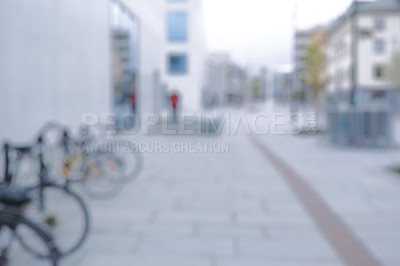 Buy stock photo Bike, parking rack and street with row for eco friendly travel, security and sustainability with blur. Bicycle, city and urban sidewalk with transportation, carbon footprint and wheels in Korea