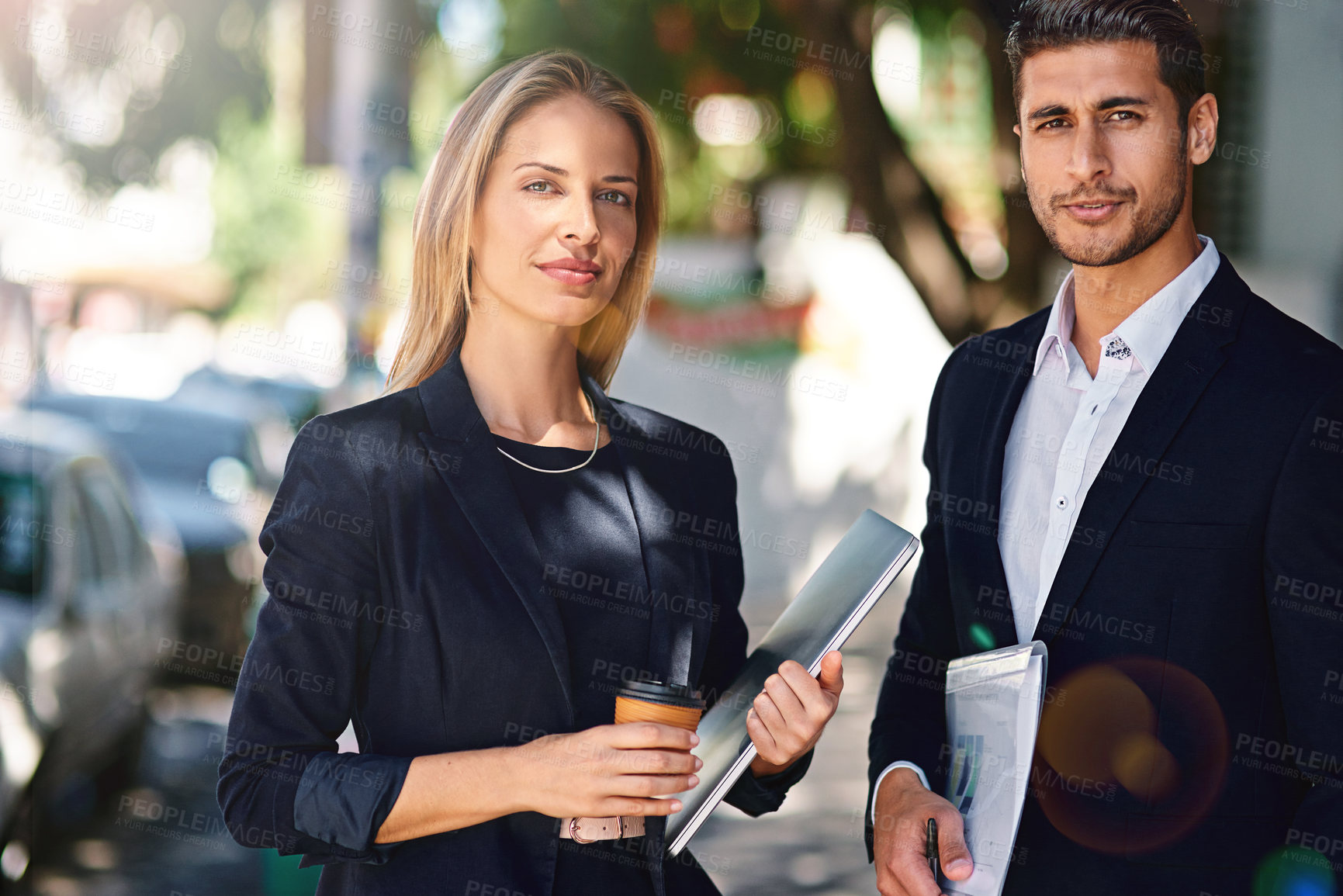 Buy stock photo Portrait of two confident coworkers standing together outside