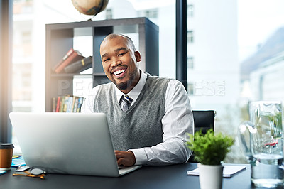 Buy stock photo Cropped portrait of a young businessman working on his laptop in the office