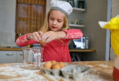 Buy stock photo Cropped shot of a little girl baking in the kitchen