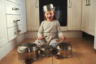 Buy stock photo Kitchen, drums and child with music on pots, instrument and creative home on holiday or vacation. Kid, drummer and development of musician with noise, sound and girl playing concert on floor in house