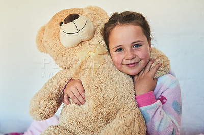 Buy stock photo Portrait of a cute little girl hugging a teddy bear