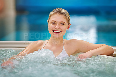 Buy stock photo Portrait of a young woman relaxing in the jacuzzi at a spa