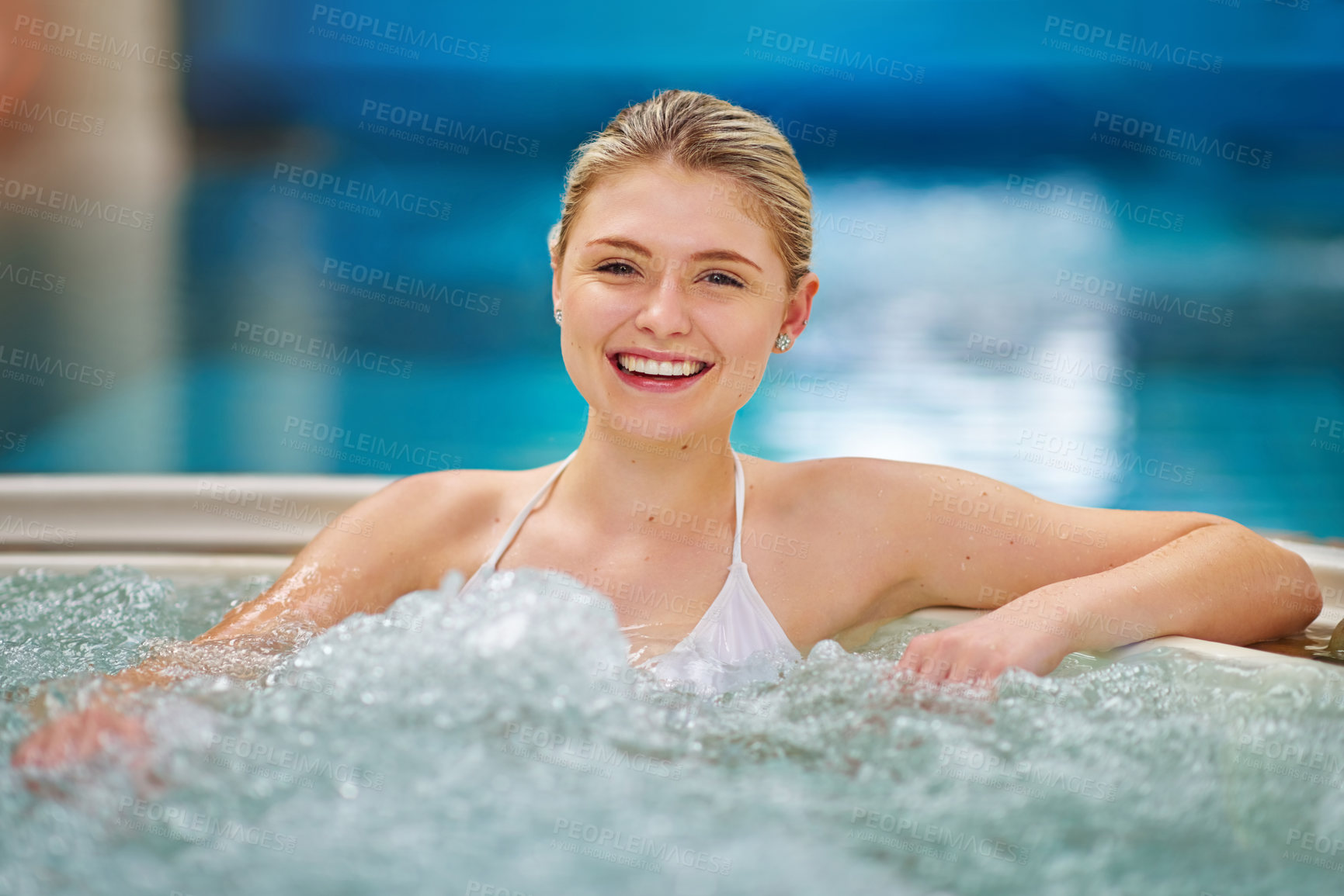 Buy stock photo Portrait of a young woman relaxing in the jacuzzi at a spa