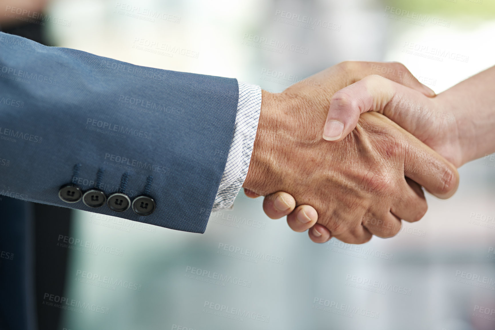 Buy stock photo Closeup shot of businesspeople shaking hands in a modern office