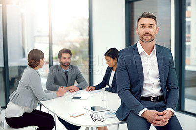 Buy stock photo Portrait of a businessman standing in a boardroom meeting with colleagues in the background