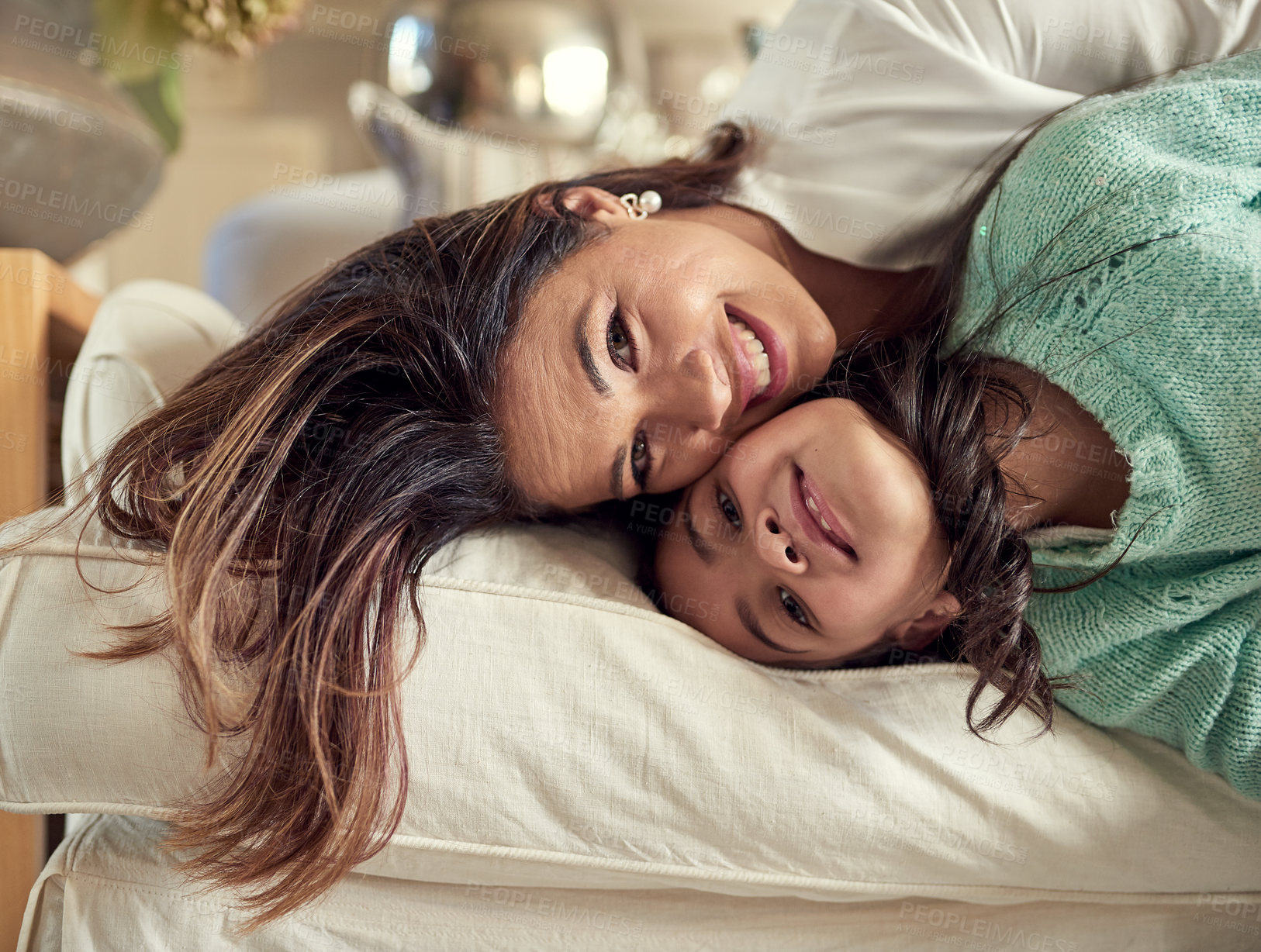 Buy stock photo Mom, girl and playful in portrait on sofa with love for child development, support and care at home. Woman, kid and crazy in living room with smile for parenting, trust and gratitude on mothers day