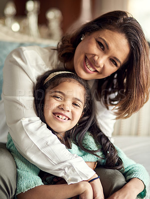 Buy stock photo Portrait of a happy mother and daughter spending quality time at home