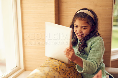 Buy stock photo Happy, kid and smile with tablet for learning, growth and child development on sofa at house. Excited, girl and technology for entertainment or study, e learning and home education with software