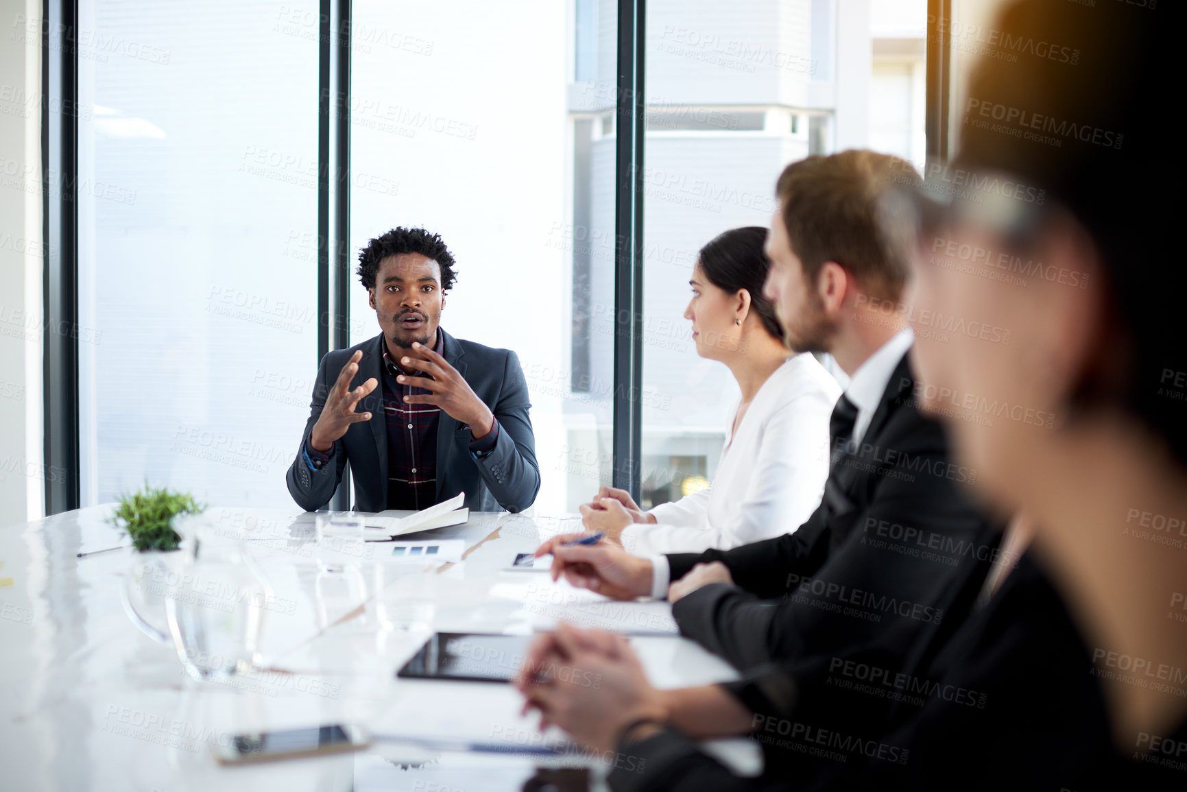 Buy stock photo Meeting, discussion and leadership with business people in conference room with planning, strategy and teamwork. Boardroom, men and women at table for review, feedback or workshop at startup office