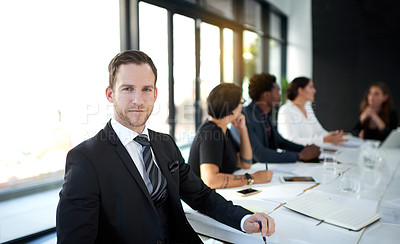 Buy stock photo Meeting, portrait and businessman in conference room with business people, confidence and leadership. Boardroom, men and women in conversation for planning, strategy or b2b workshop at startup office