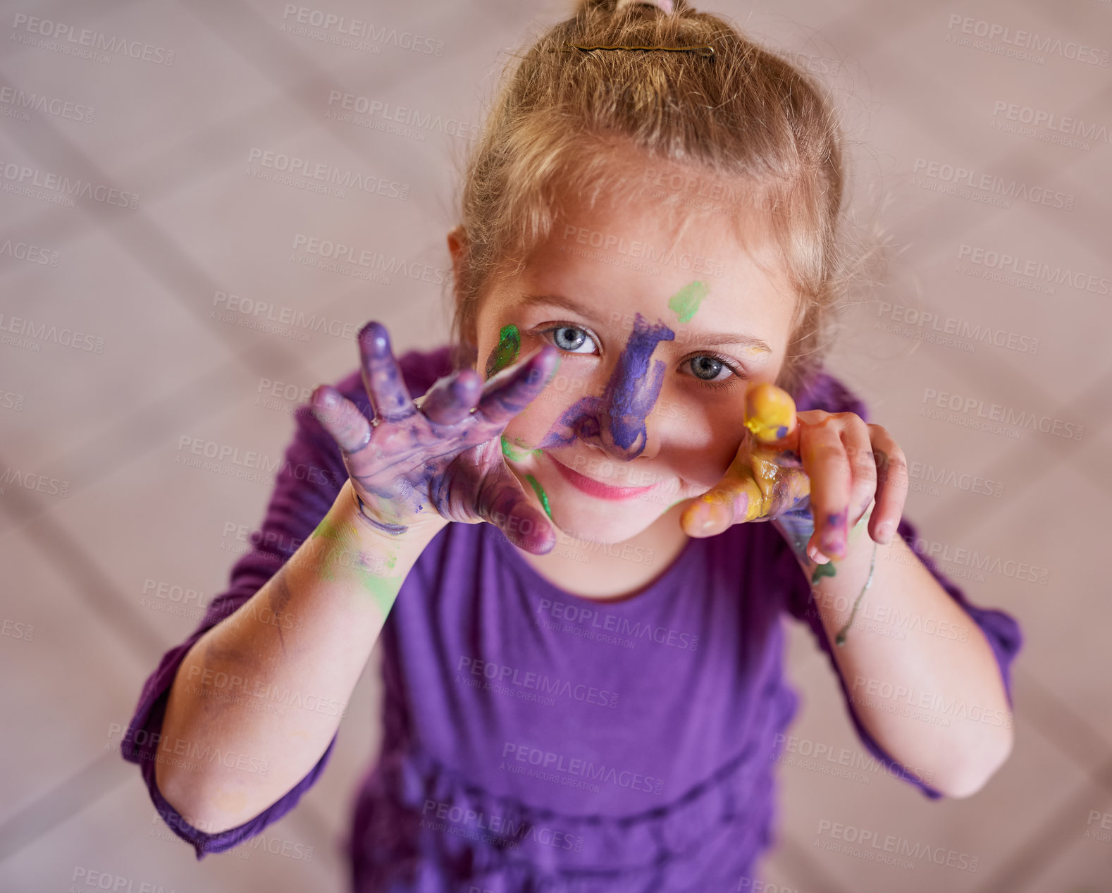 Buy stock photo Cropped portrait of a little girl with her hands and face covered in paint