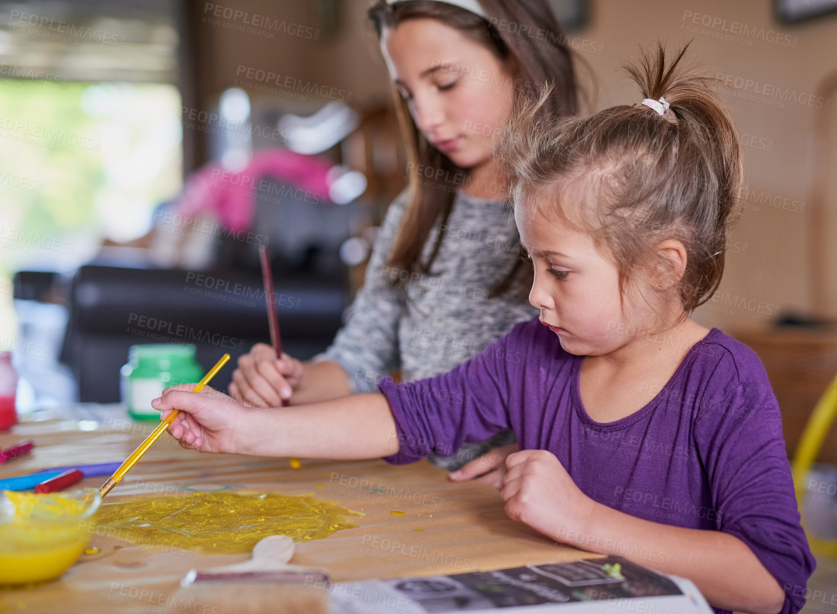 Buy stock photo Cropped shot of two little girls painting together at home