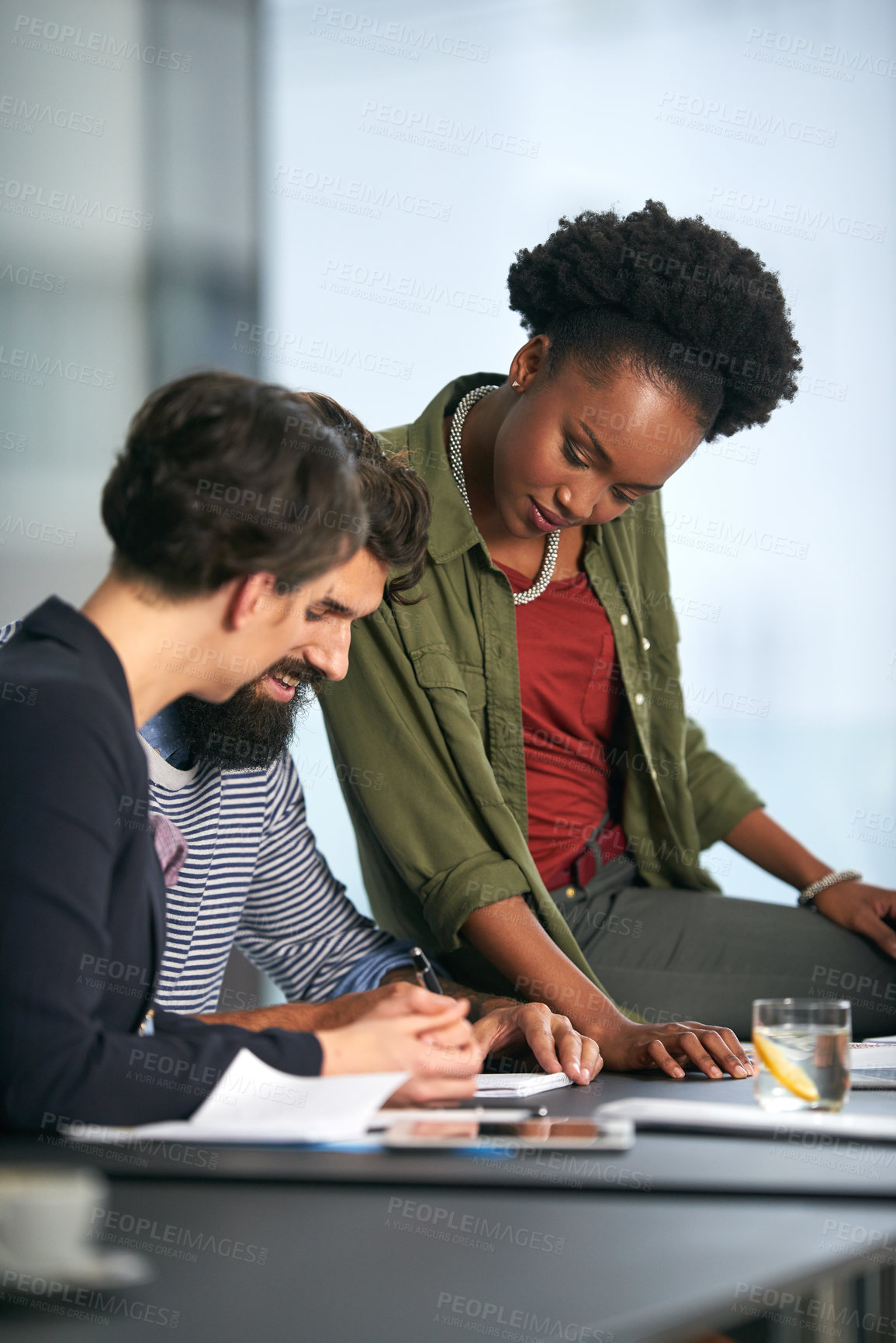 Buy stock photo Black woman, coaching and meeting with team for training staff, collaboration or assistance at office. African female person or employee helping colleagues with paperwork or documents for review