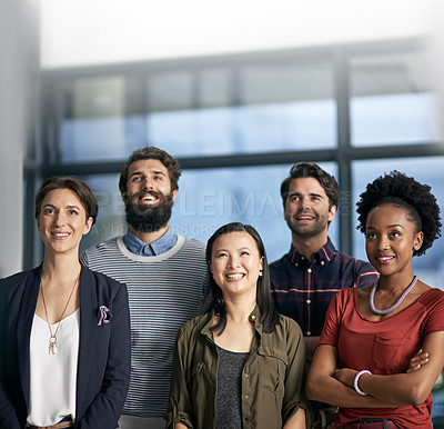 Buy stock photo Cropped shot of a group of businesspeople standing together in an office