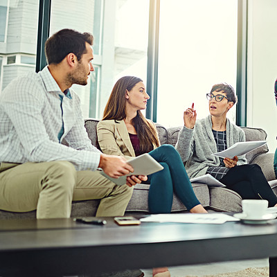 Buy stock photo Collaboration, papers and employee talking on sofa for communication, teamwork and conversation in office. Planning, ideas and employees with tablet or technology for startup project with discussion