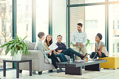 Buy stock photo Shot of a group of colleagues having a discussion in an office